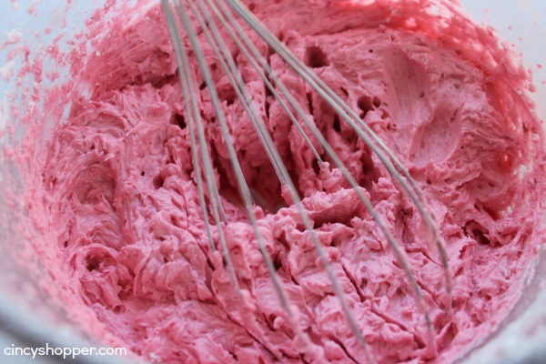 Heart Brownies with Raspberry Buttercream filling- A fudgy brownie in a heart shape filled with a yummy raspberry buttercream filling. Perfect for Valentines Day!