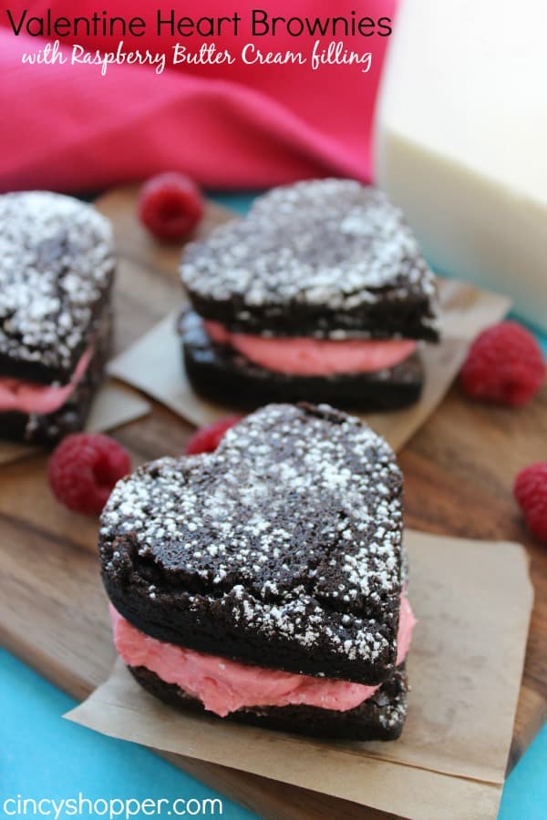 Heart Brownies with Raspberry Buttercream filling- A fudgy brownie in a heart shape filled with a yummy raspberry buttercream filling. Perfect for Valentines Day!