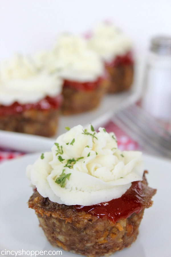 Meatloaf Cupcakes -Super fun twist on traditional meatloaf. Serve these mashed potato topped meatloaves for family dinner or great for a crowd.