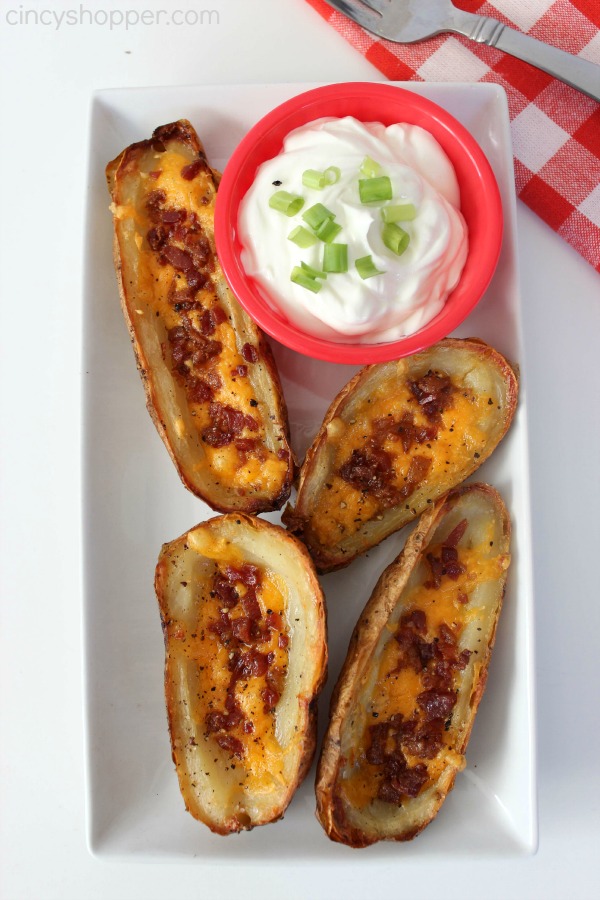 Copycat TGI Friday’s Potato Skins Recipe. Potato Skins loaded up with cheese and bacon. Make your skins at home to save $$'s. Perfect for entertaining! 