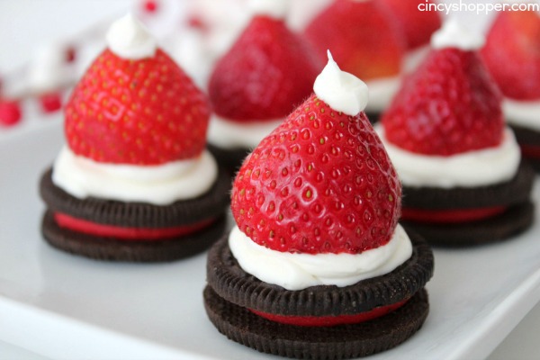 Santa Hat Oreos - A Super Easy Holiday dessert! Oreo Cookies, Strawberries and Icing make this a fun treat! Perfect for classroom parties!