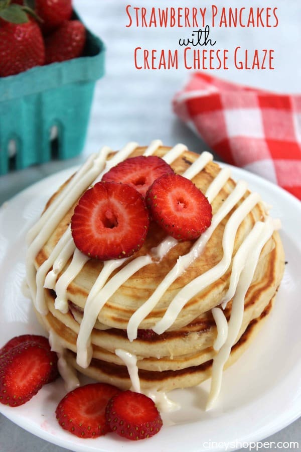 Strawberry Pancakes with Cream Cheese Glaze- pancakes are made with fresh strawberries and then topped with a sweet cream cheese glaze. Perfect for a wonderful weekend or even Valentine's breakfast!