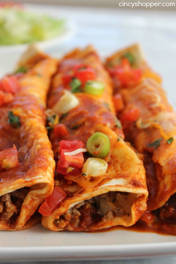 Easy Beef Enchiladas- Enjoy a Mexican Dinner at home in no time at all.  Full of great flavor and smothered with cheese