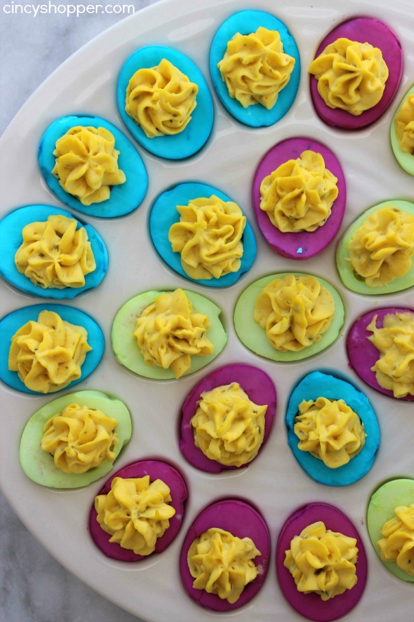 Colored Easter Deviled Eggs- These eggs are filled with traditional deviled egg filling but the whites get a splash of color! Super fun Easter dinner idea.