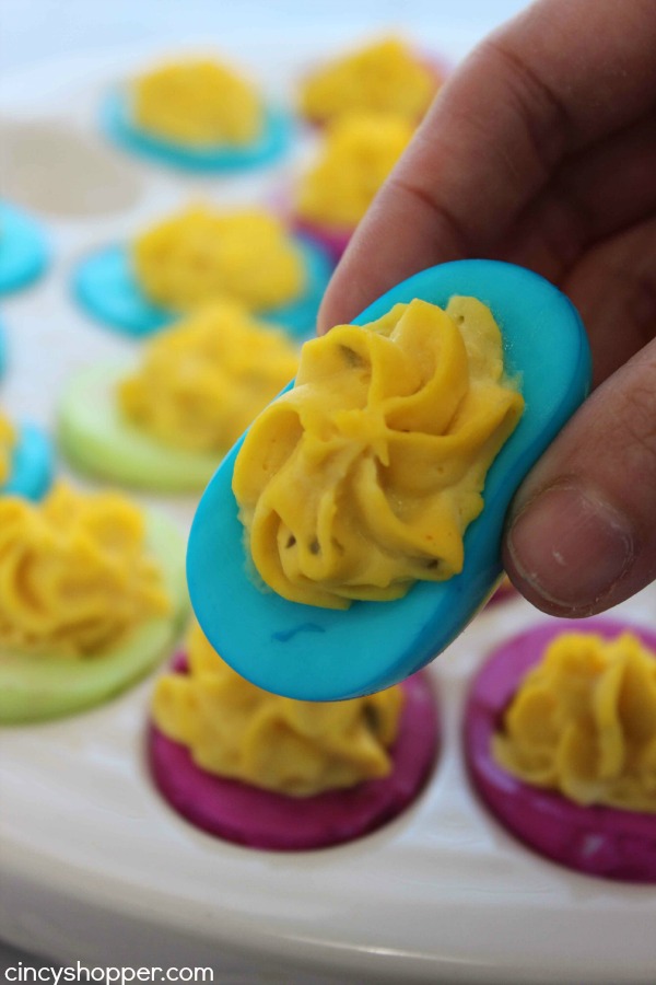Colored Easter Deviled Eggs- These eggs are filled with traditional deviled egg filling but the whites get a splash of color! Super fun Easter dinner idea.