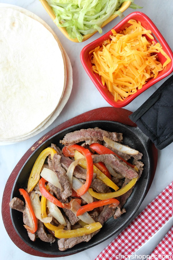 Sizzling Steak Fajitas- Loaded with peppers and onions. Enjoy a Mexican dinner at home. All ingredients can be purchased at Aldi for under $13 and feed a larger family.