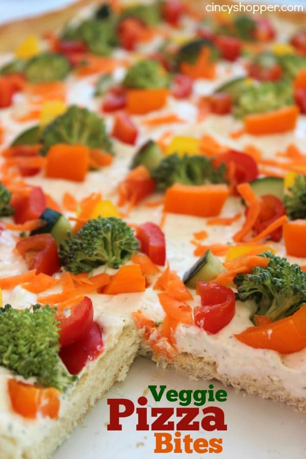 Veggie Pizza Bites- Crescent crust topped with ranch dip mixture then loaded with veggies. Perfect cold bite sized appetizer.