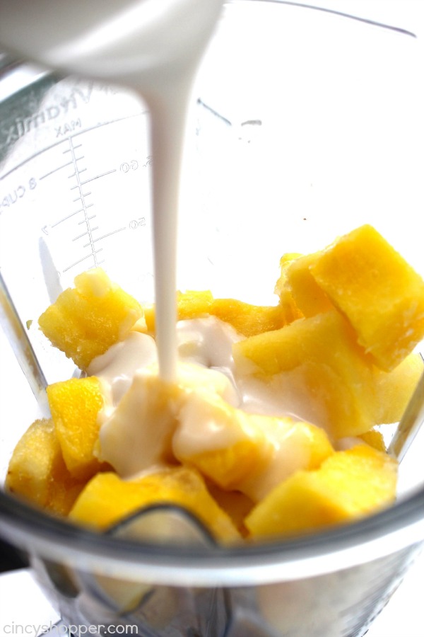 Caribbean Slush - loaded with pineapple, banana, and coconut flavors that are sure to keep you refreshed this summer. Super simple beverage that is great for hot summer days.