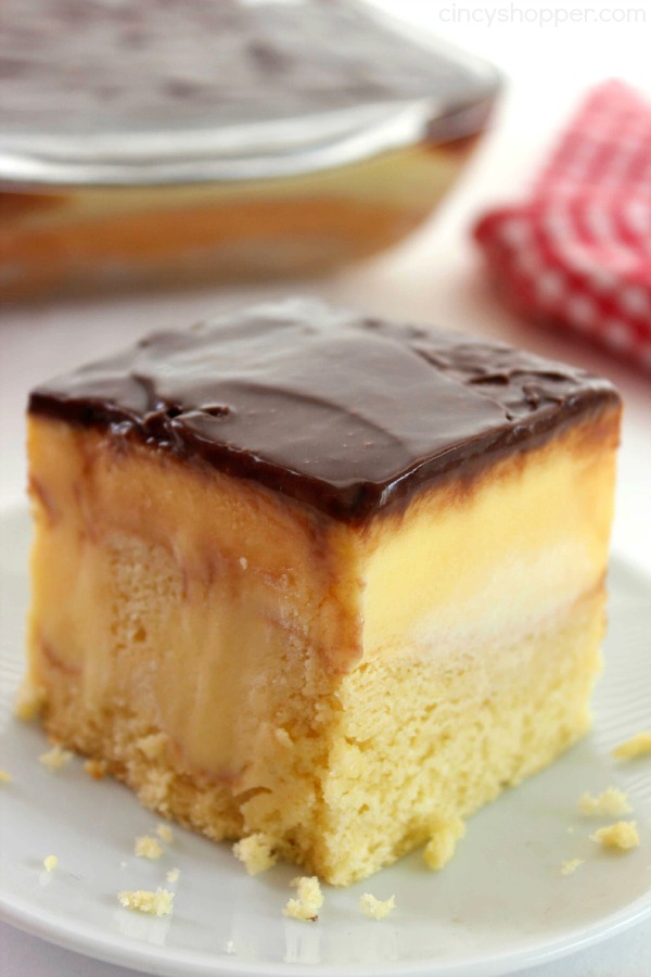 Boston Cream Poke Cake - so super simple and uses a boxed cake mix, pudding, and store bought frosting. Great for potlucks and summer bbq dessert.