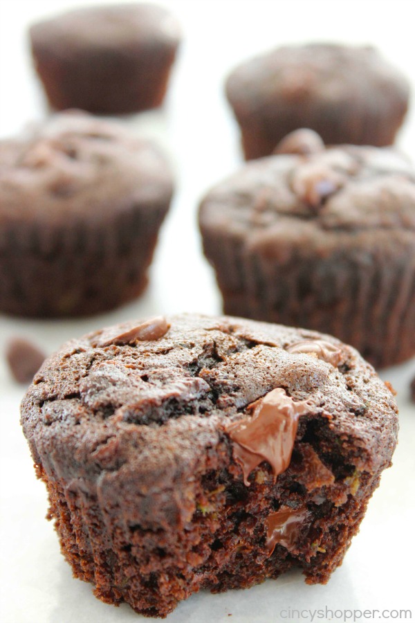 Double Chocolate Zucchini Muffins - Super Moist. Loaded with double the chocolate and perfect for using up your left over garden zucchini.
