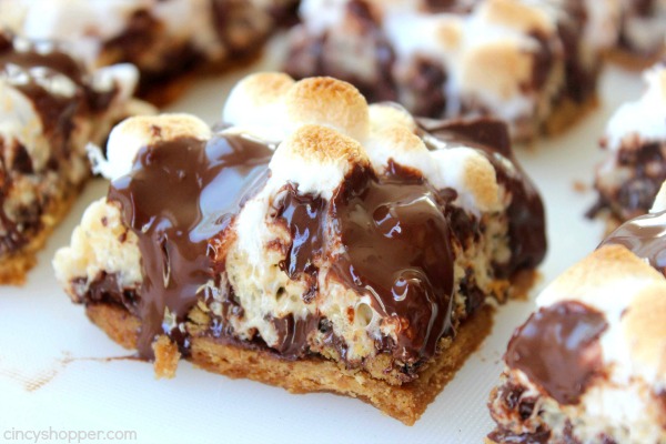 S'Mores Krispie Treats -Perfect treat. Graham cracker crust, then topped with krispie treat, marshmallows ,and loads of chocolate. Super messy and super yummy. 