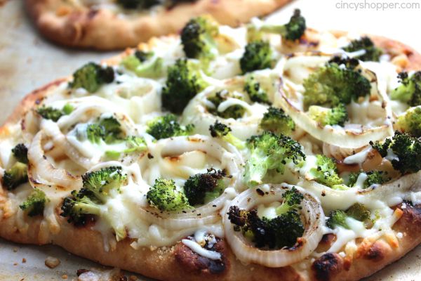 Broccoli Flatbread Pizza -loaded with broccoli, onions, cheese and lots of garlic. A super easy and quick weeknight meal that is sure to please.