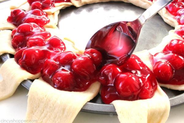 Cherry Cream Cheese Crescent Ring - Super simple, uses store bought crescent rolls. Tastes amazing. If you are feeding a crowd breakfast or even dessert, this danish ring is going to be perfect.