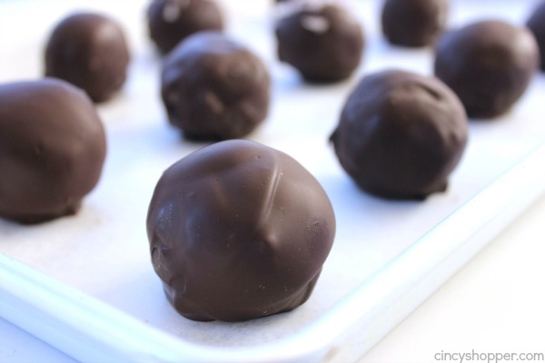 Coconut Truffles - great candy for Christmas. Amazing coconut cream filling coated in dark chocolate. Perfect for dessert or even for gifting.