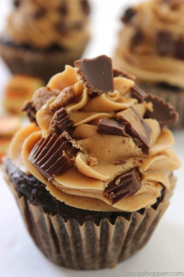 Reese's Peanut Butter Cupcakes - simple chocolate cupcake stuffed with a Reese's Miniature then topped with a creamy peanut butter frosting.