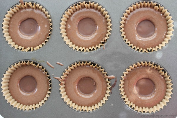 Reese's Peanut Butter Cupcakes - simple chocolate cupcake stuffed with a Reese's Miniature then topped with a creamy peanut butter frosting.