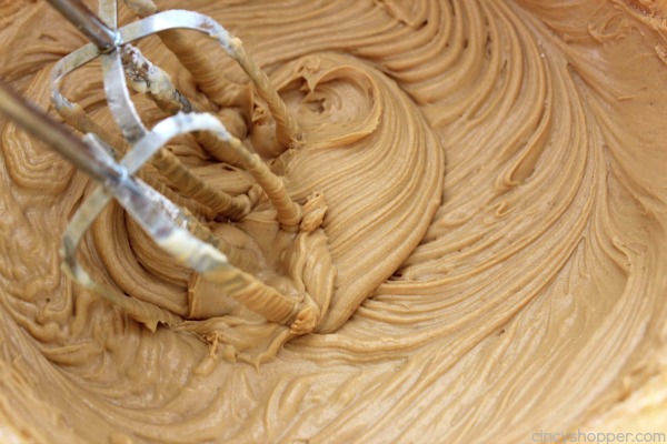 Reese's Peanut Butter Cupcakes - simple chocolate cupcake stuffed with a Reese's Miniature then topped with a creamy peanut butter frosting.