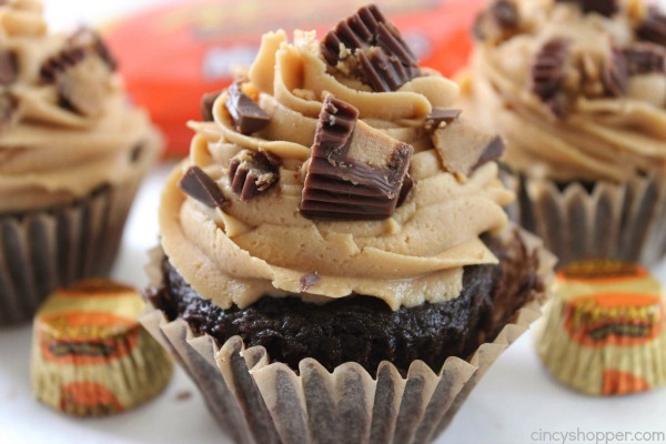 Reese's Peanut Butter Cupcakes - simple chocolate cupcake stuffed with a Reese's Miniature then topped with a creamy peanut butter frosting.