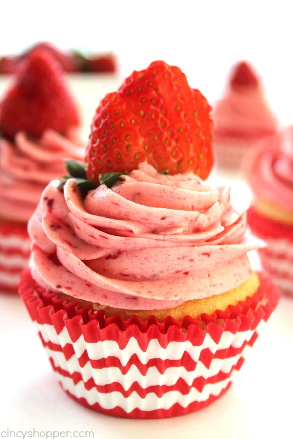 Strawberry Pie Cupcakes- Stuffed with strawberry pie filling and topped them off with the best strawberry butter cream frosting.