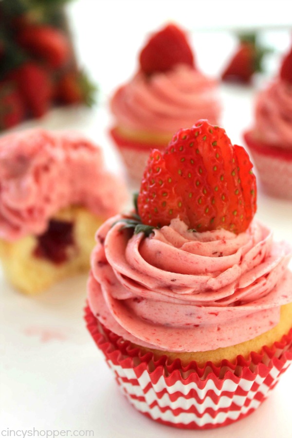 Strawberry Pie Cupcakes- Stuffed with strawberry pie filling and topped them off with the best strawberry butter cream frosting.