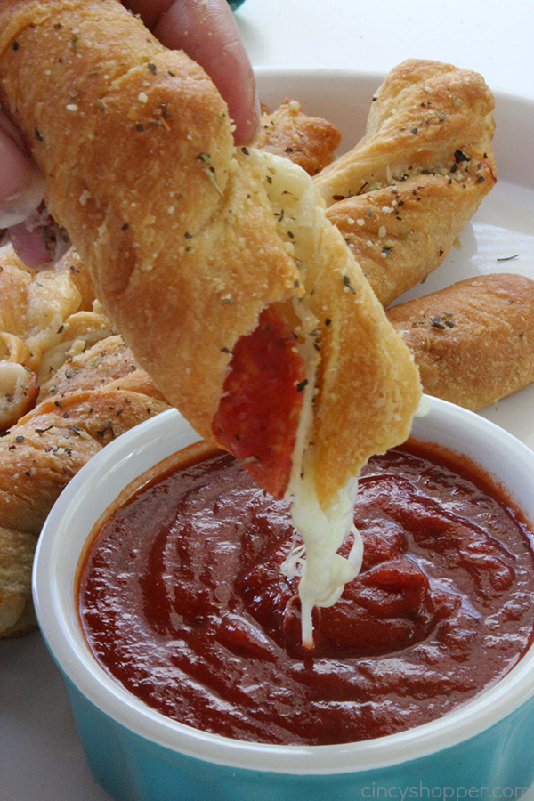 Pepperoni Pizza Twists - Twisted Crescent Rolls loaded with pepperoni and cheese, dusted with a delicious parmesan seasoning.