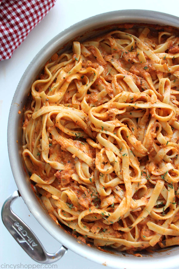 Creamy Tomato Fettuccine - perfect for a dinner side dish or even a meal. The pasta dish is creamy, full of flavor, and so easy to make. My family LOVES it!