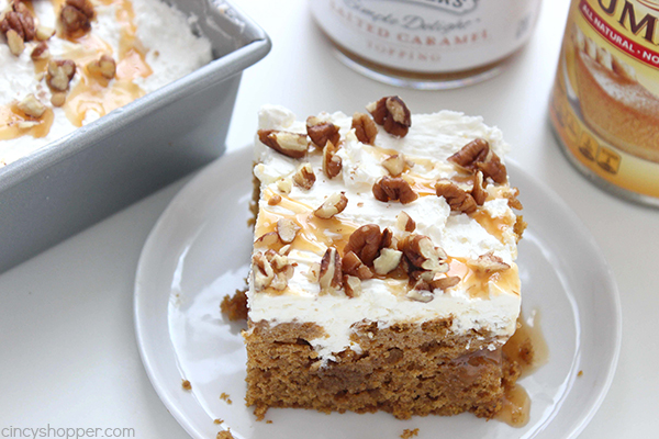 Pumpkin Caramel Poke Cake - lots of caramel and a cream cheese whipped topping to make it extra delicious. Perfect for your Thanksgiving dessert.