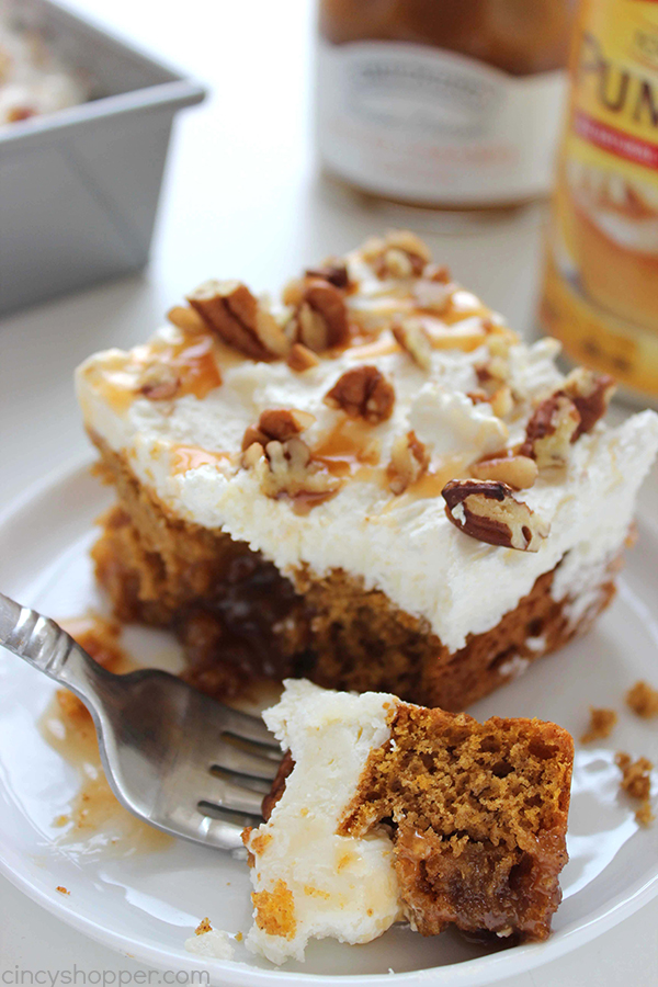 Pumpkin Caramel Poke Cake - lots of caramel and a cream cheese whipped topping to make it extra delicious. Perfect for your Thanksgiving dessert.
