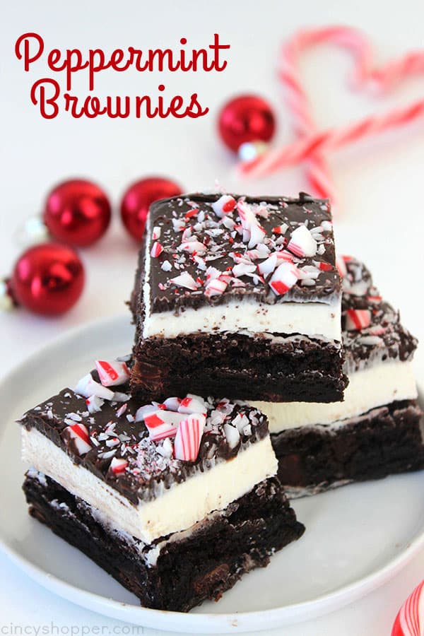Peppermint Brownies - filled with a great peppermint buttercream frosting, a layer of chocolate frosting, and then topped with peppermint crunch sprinkles. Perfect for a Christmas dessert. Since they start with a boxed mix, they can be made quickly.