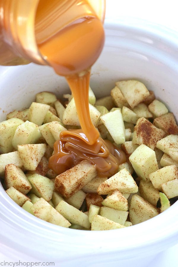Grab your Crock-Pot and make this Slow Cooker Caramel Apple Dip and Cinnamon Chips. You will find it just like apple pie in the form of a dip. Perfect for feeding a crowd this fall.