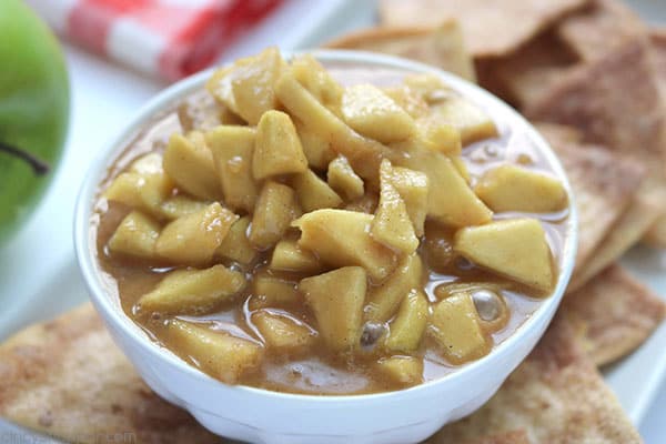 Grab your Crock-Pot and make this Slow Cooker Caramel Apple Dip and Cinnamon Chips. You will find it just like apple pie in the form of a dip. Perfect for feeding a crowd this fall.