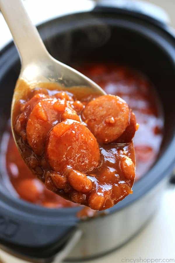 This Slow Cooker Barbecue Kielbasa and Beans will be perfect for your next pot luck or summer BBQ. The dish is loaded with flavor and just a hint of spice. #SlowCooker #BBQ