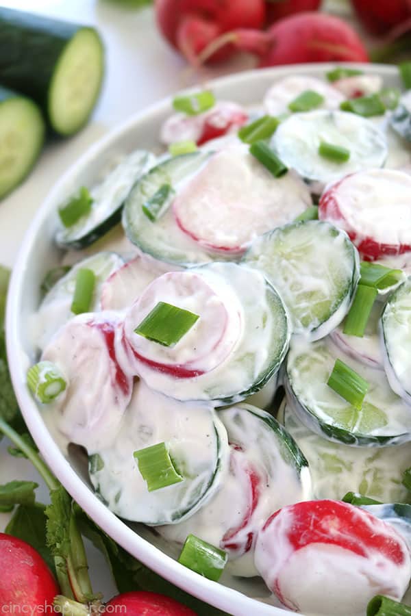 This Creamy Cucumber Radish Salad will be a great side dish for your summer dinners, picnics, or family BBQ's. The salad is loaded with fresh cucumbers, radishes, and coated in a creamy garlic dressing #SummerSalad
