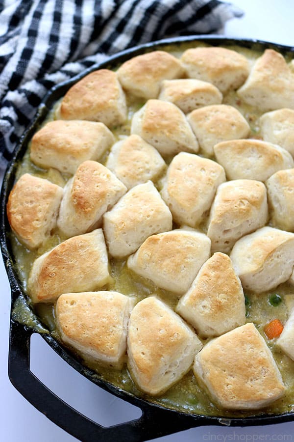 If you need a simple dinner idea, this Easy Skillet Chicken & Biscuits will be great for you to make. You will find it loaded with chicken, veggies and then topped with biscuits. #ChickenDinner
