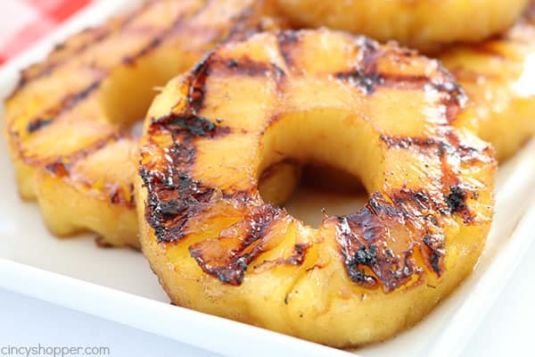 This super easy Brown Sugar Grilled Pineapple will make for a perfect side dish or even a dessert this summer. With just a couple simple ingredients like butter, vanilla, brown sugar, and cinnamon, you can whip it up and toss it on the grill in no time at all!