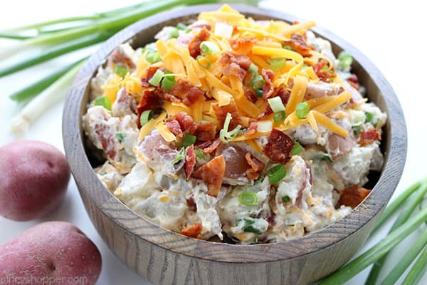 This Loaded Potato Salad will make for a great side dish at your summer picnics and BBQ's. We toss cubed potatoes with the fixings that you would normally find in a loaded baked potato. Lots of cheese, bacon, green onion, and of course sour cream. #SummerSalad