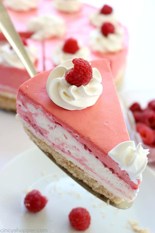 This No Bake Raspberry Creamsicle Cheesecake is out of this world AMAZING! We start with a Nilla Wafer crust, then add on layers of delicious raspberry cream. It's so simple to make. perfect summer dessert. #Cheesecake #NoBake