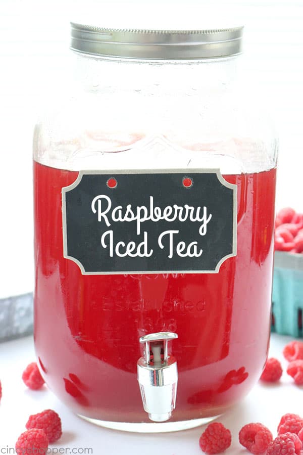 Raspberry Iced Tea - super refreshing cold beverage for hot summer days. We make it with fresh raspberries, squeezed lemon, and just a bit of sugar. Feel free to add in more sugar if you like your tea super sweet. #IcedTea #Raspberries #SummerDrink