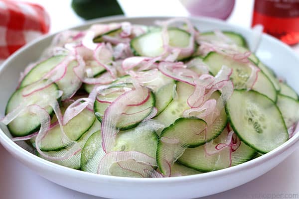 Cucumber and Onion Salad - perfect for a summer side dish. You will find thin sliced cucumbers and sweet onion coated in a sweet vinegar. Traditional, Easy and so good. #SummerSalad #Salad #Cucumbers