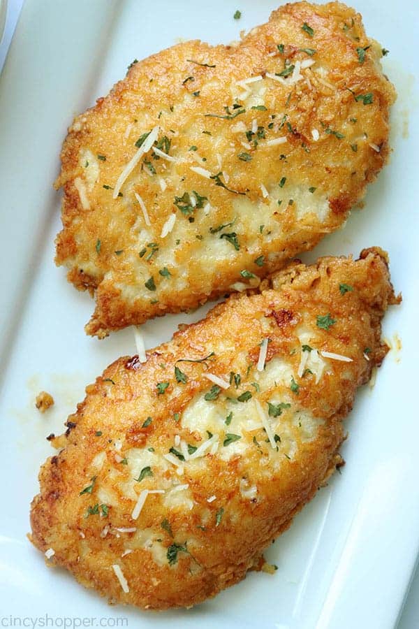 Parmesan Crusted Chicken on a white plate.