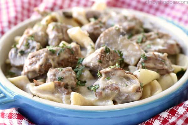 Slow Cooker Beef Stroganoff - tender beef tips, onions, mushrooms, all in a creamy sauce. Serve over egg noodles for an easy family favorite meal. Make it in your Crock-Pot!