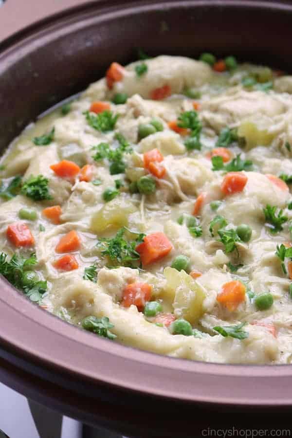 Slow Cooker Chicken and Dumplings - so easy to make right in your Crock Pot. You will find the recipe super easy to make with simple ingredients. Have this classic homemade comfort dish cooking in no time at all!