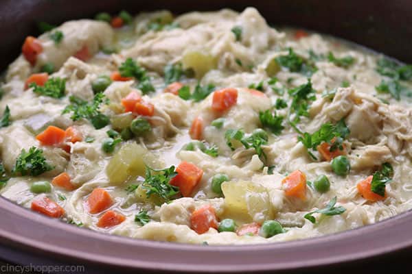 Slow Cooker Chicken and Dumplings - so easy to make right in your Crock Pot. You will find the recipe super easy to make with simple ingredients. Have this classic homemade comfort dish cooking in no time at all!