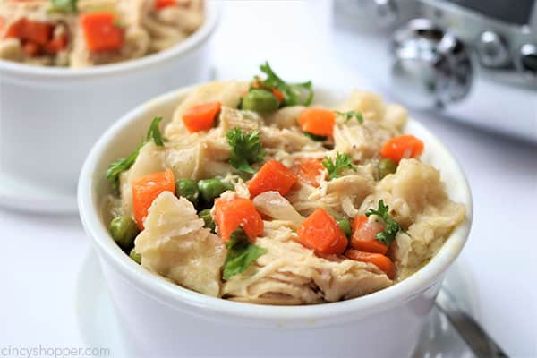 Slow Cooker Chicken and Dumplings - so easy to make right in your Crock Pot. You will find the recipe super easy to make with simple ingredients. Have this classic homemade comfort dish cooking in no time at all!