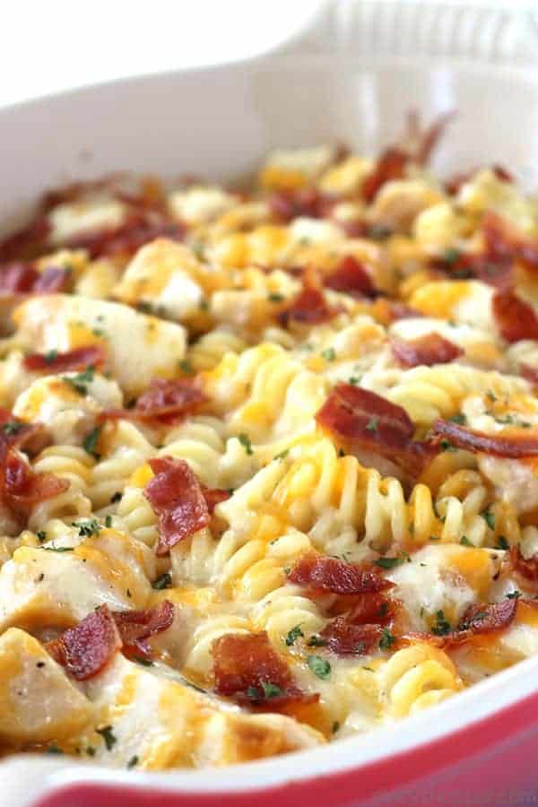 Easy Chicken Bacon Ranch Casserole - perfect for a quick and simple dinner. We have pasta, chicken, easy Alfredo with ranch dressing, bacon, and of course, cheese. 