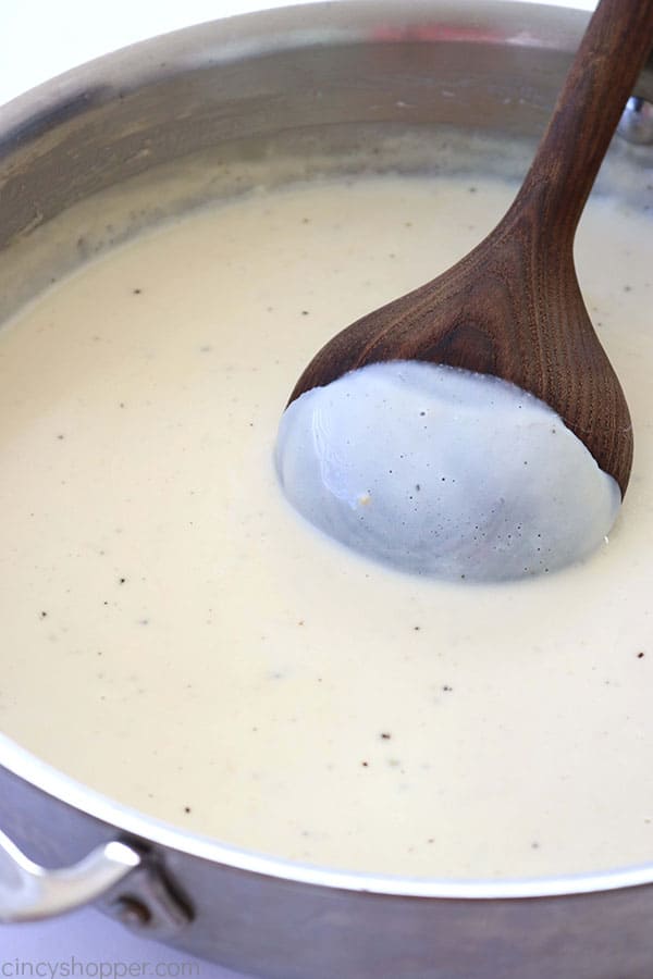 White Sauce in a pan with spoon
