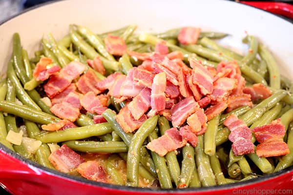 Adding the bacon to make southern green beans.