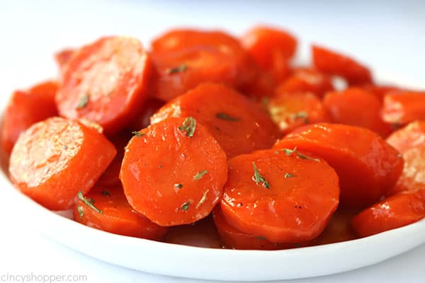 Glazed carrots on a white plate.