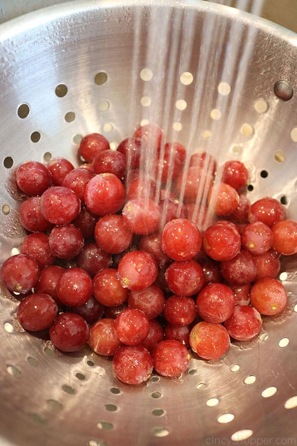 Rinsing red grapes.