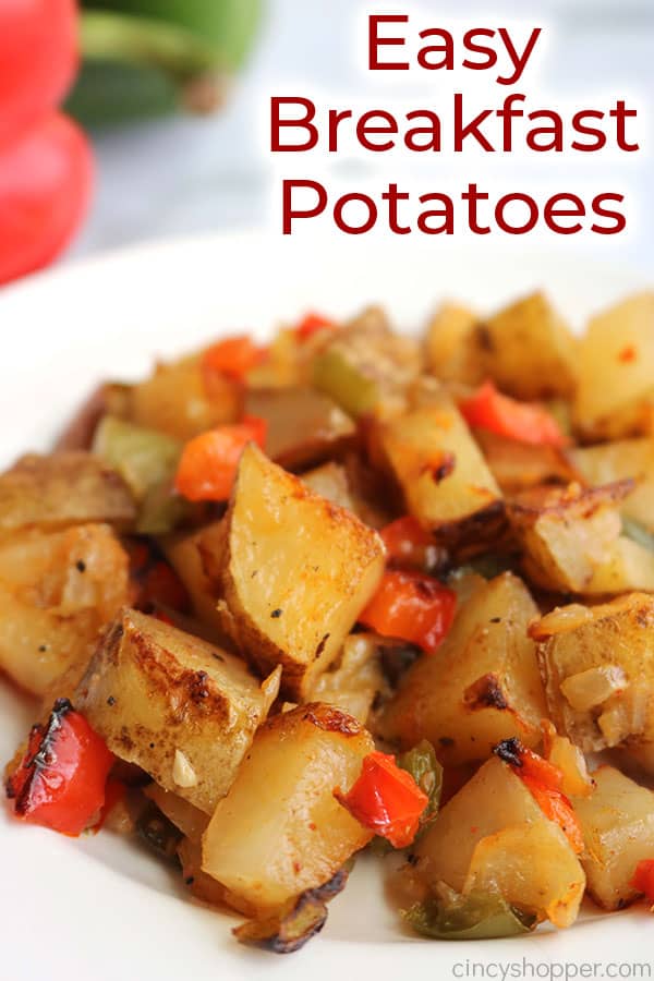 Breakfast potatoes with peppers and onions on a plate with text.